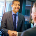 Young Man Smiling Shaking Hiring Managers Hand. Get Hired Fast